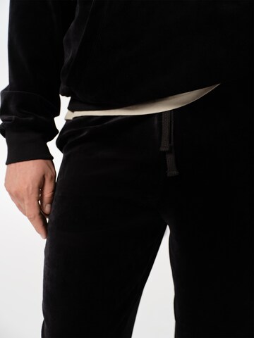 ABOUT YOU x Jaime Lorente Tapered Trousers 'Fernando' in Black