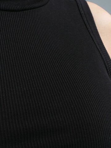 Haut 'Fleur' Seamless Basic en noir