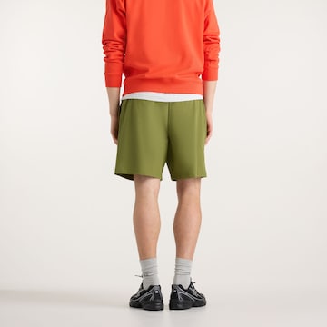 new balance - Loosefit Pantalón 'Athletics Stretch Woven Short 7"' en verde