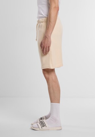 regular Pantaloni 'Terry' di Urban Classics in arancione