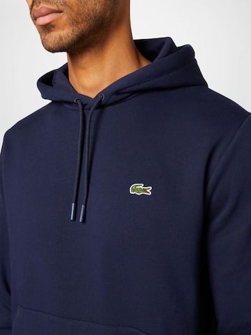 LACOSTE Sweatshirt i blå