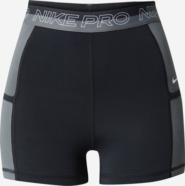 Pantalon de sport NIKE en noir : devant