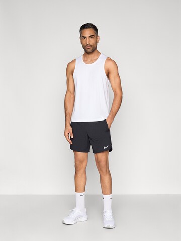NIKE Loosefit Παντελόνι φόρμας σε μαύρο