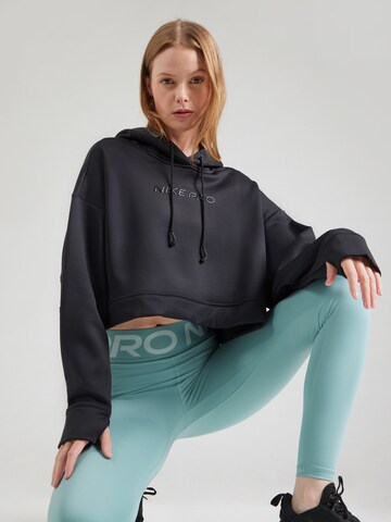 NIKE Urheilullinen collegepaita värissä musta: etupuoli