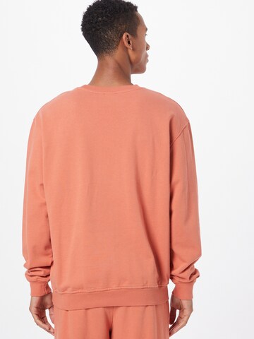 ABOUT YOU Limited Sweatshirt 'Kai' by Jannik Stutzenberger' in Orange