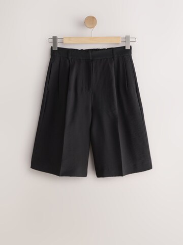 Loosefit Pantaloni con pieghe di Next in nero