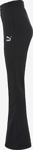 PUMA Rozkloszowany krój Spodnie 'Classics' w kolorze czarny
