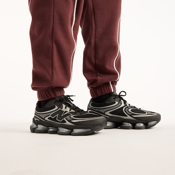 new balance - Perna larga Calças 'Trackside Polar Fleece Jogger' em vermelho