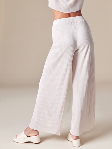 ABOUT YOU x Laura Giurcanu Wide leg Trousers 'Asmin' in Beige