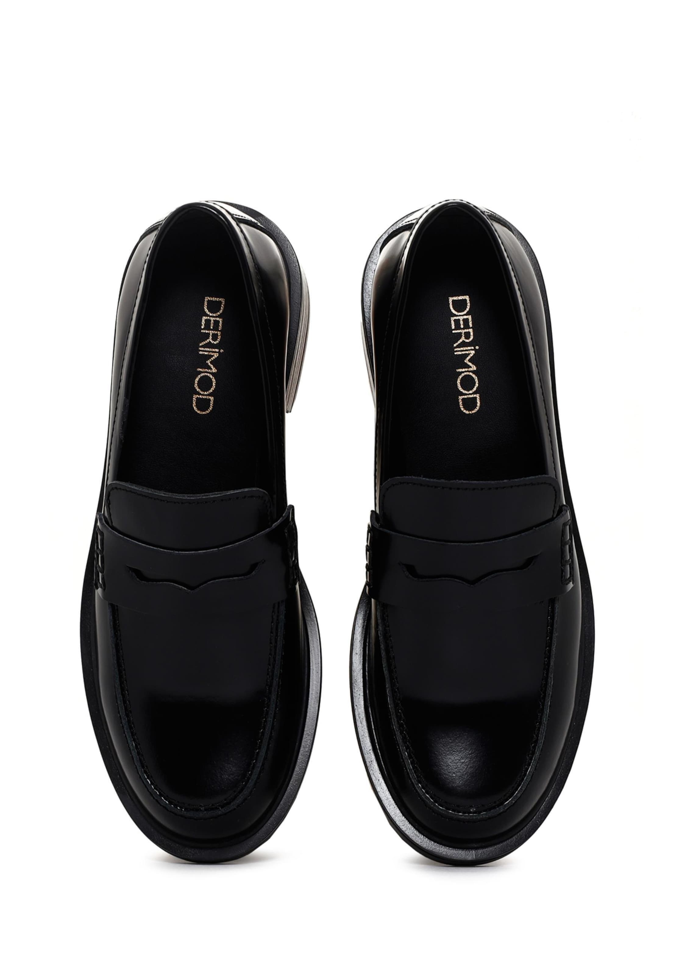 Slipper di Derimod in nero