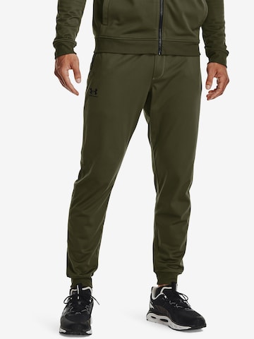 UNDER ARMOUR Tapered Workout Pants in Green: front