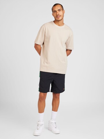 ELLESSE Loose fit Pants 'Tiaki 7' in Black