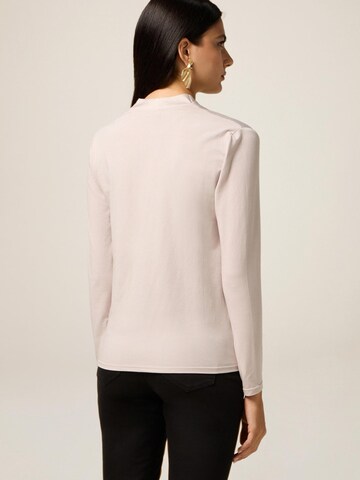Top di oltre in beige