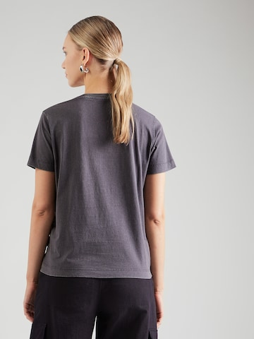 GUESS Póló 'BEAR' - fekete