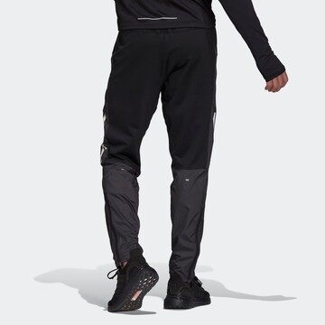Regular Pantalon de sport 'Own The Run Astro' ADIDAS SPORTSWEAR en noir
