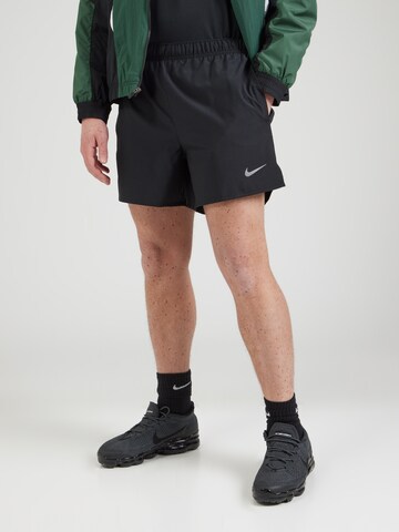 NIKE Regular Sports trousers in Black: front