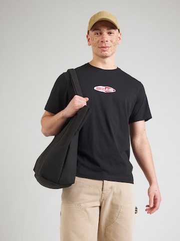T-Shirt GUESS JEANS en noir : devant