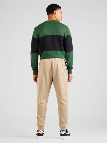NIKE Zúžený Sportovní kalhoty – zelená