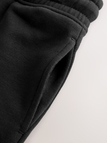 juoda Next Siaurėjantis Kelnės