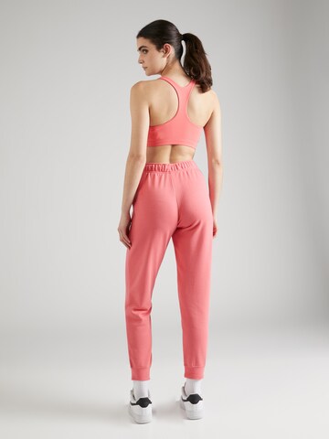 Nike Sportswear - Tapered Pantalón en naranja