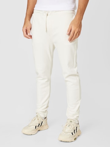 TOM TAILOR DENIM Tapered Pants in Beige: front