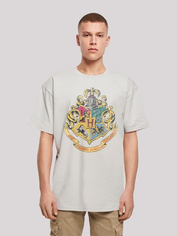F4NT4STIC Shirt 'Harry Potter Distressed Hogwarts Crest' in Grau: Vorderseite