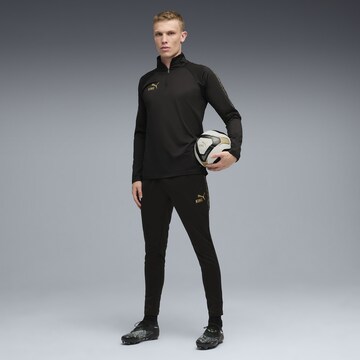 T-Shirt fonctionnel 'King Touch' PUMA en noir