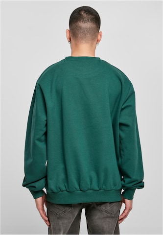Bluză de molton de la Karl Kani pe verde
