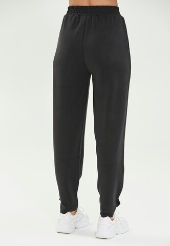 Athlecia Loose fit Workout Pants 'Nikoni' in Black