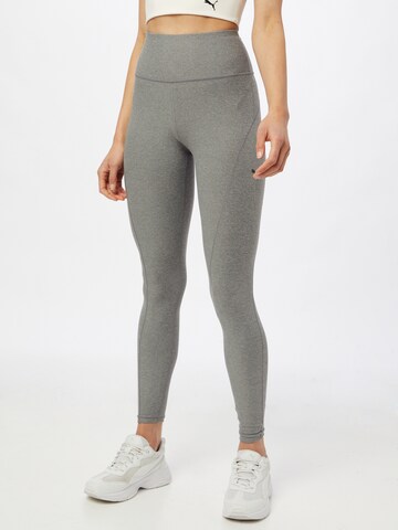 Skinny Pantalon de sport PUMA en gris : devant