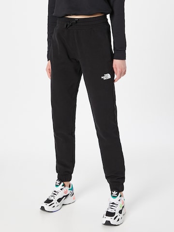 THE NORTH FACE - Tapered Pantalón deportivo en negro: frente