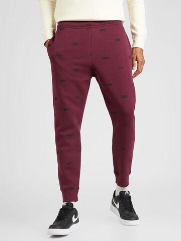 Nike Sportswear Tapered Trousers in Brown: front
