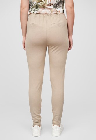 Tapered Pantaloni con pieghe di Cloud5ive in beige