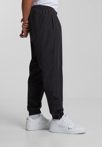 Effilé Pantalon de sport 'KM-PL074-001-01' Karl Kani en noir