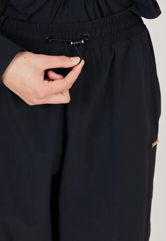 Athlecia Tapered Sports trousers 'Hero' in Black
