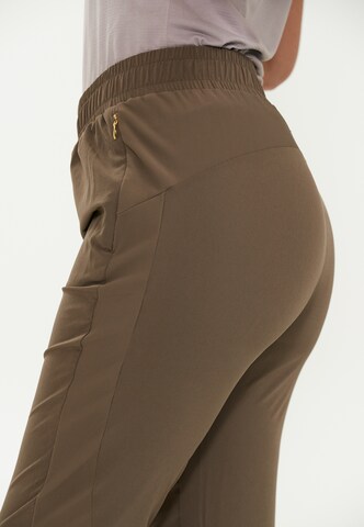 Athlecia Regular Workout Pants 'Timmie' in Brown