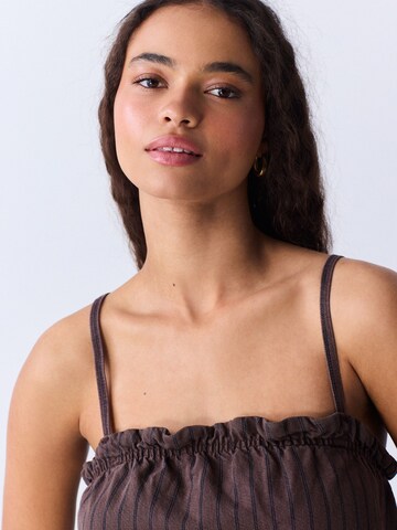 Haut Next en marron