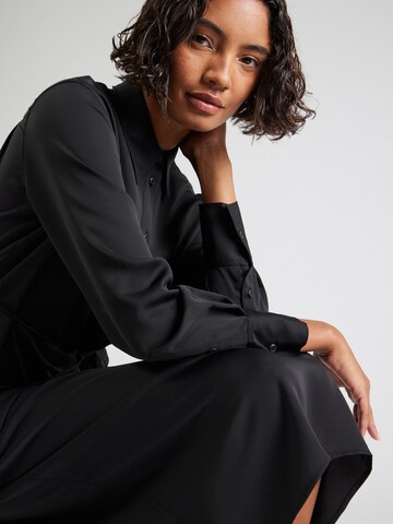 Calvin Klein - Vestidos camiseiros em preto