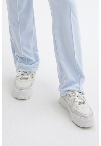 Sneaker bassa di Juicy Couture in bianco