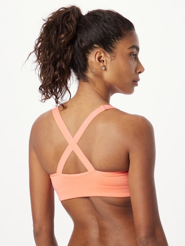 Bustino Reggiseno sportivo 'ACCELERATE' di ASICS in arancione