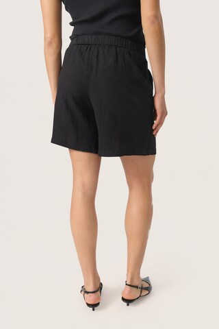 SOAKED IN LUXURY Loosefit Kalhoty 'Belira' – černá