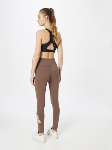 Skinny Pantalon de sport 'All Szn X Logomania' ADIDAS SPORTSWEAR en marron