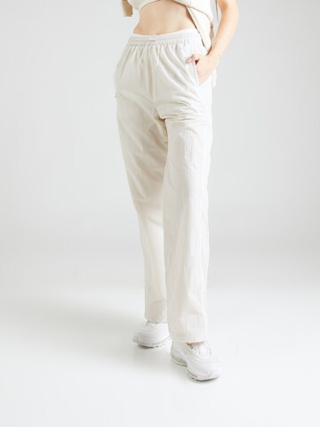 Nike Sportswear - Loosefit Pantalón en beige: frente