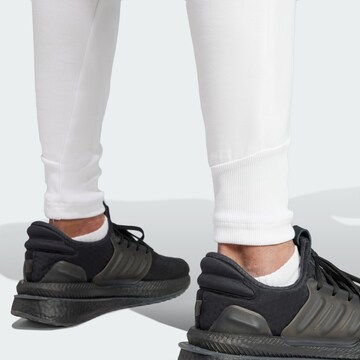 ADIDAS SPORTSWEAR Дънки Tapered Leg Спортен панталон 'Z.N.E. Premium' в бяло