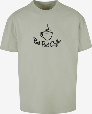 Merchcode T- Shirt 'But First Coffee' in Grün: predná strana
