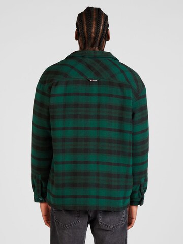 Tommy Jeans Φθινοπωρινό και ανοιξιάτικο μπουφάν σε πράσινο