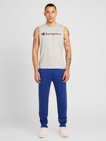 Champion Authentic Athletic Apparel Tapered Housut 'Legacy' värissä sininen