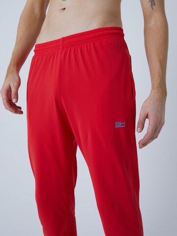 Coupe slim Pantalon de sport 'Slim Training Pants' SPORTKIND en rouge