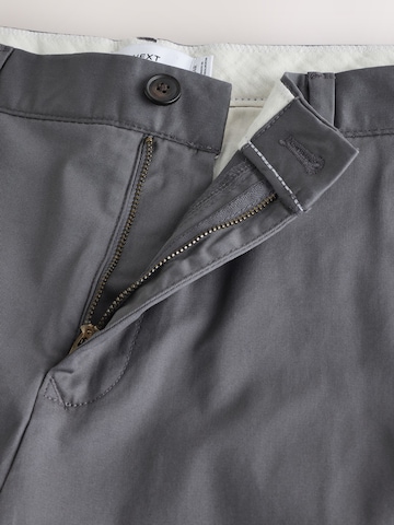 Slimfit Pantaloni chino di Next in grigio