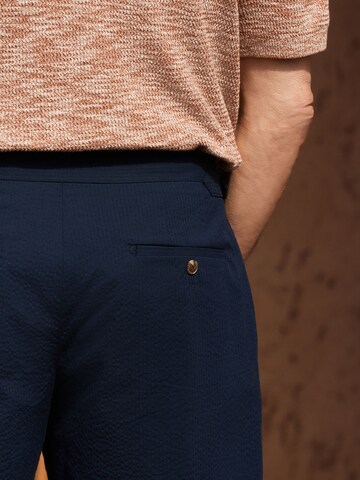 Slimfit Pantaloni con pieghe di Next in blu